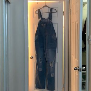 Distressed denim overalls